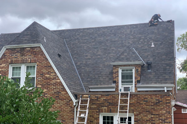 Someone Working on top of roof